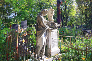 Antique sculpture over the headstone of an old grave in Baikove Cemetery in Kyiv, Ukraine