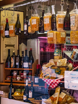Street window of a grocery with ialian pasta and wine - Bologna, Italy