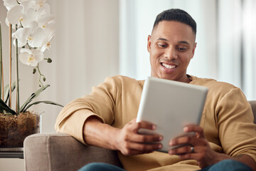Tablet, sofa and black man relax with website information, subscription service or surfing social media app in home living room. Happy man with home technology reading ebook on a digital application