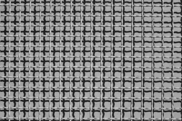 Fototapeta premium evocative black and white texture image of a green gate grate 