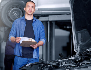 Engineer, mechanic and car engine manager with checklist working on performance quote. Portrait of...