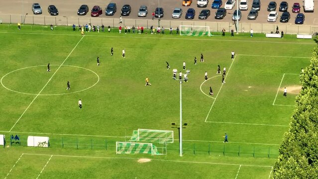 Aerial top down view of soccer field two professional teams playing. Energetic game in the middle of the field. Women's football. Important match on international championship. Beautiful aerial shot