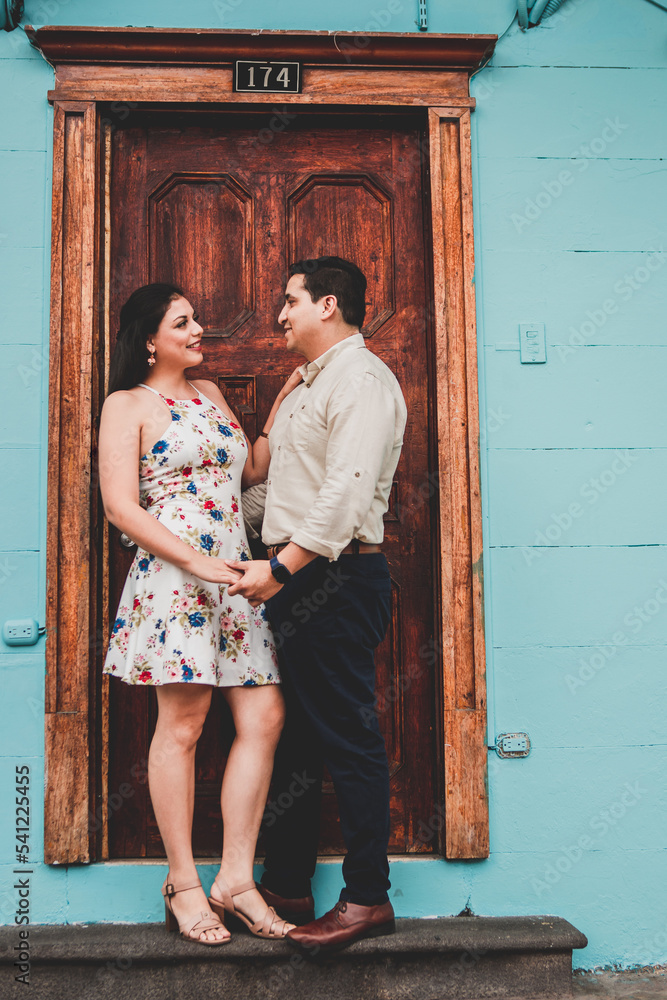 Wall mural couple in front of house