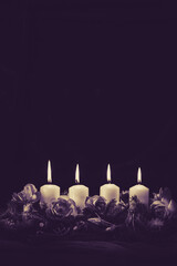 advent candles burning, copy space, isolated, black background - 541225668