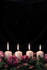 advent candles burning, copy space, isolated, black background