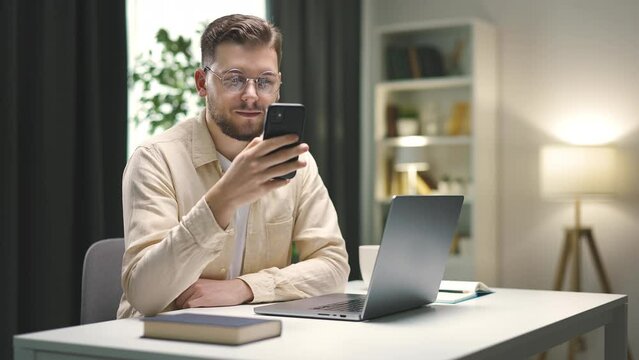 Bearded man working with devices at home, handsome smart businessman using smartphone swiping for studying or spending leisure time. Multiscene sequence