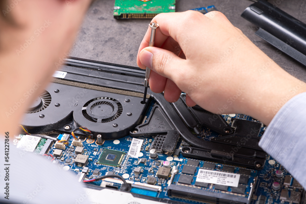 Aufkleber hands fixing motherboard of pc or laptop notebook close up in service. laptop repair service. pc har