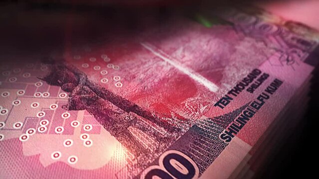 Uganda money Shilling money counting. UGX banknotes. Fast cash note count macro loop. Business, finance and economy. Loopable and seamless concept.