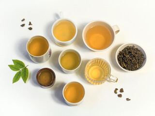 cup of tea on white background. Oolong tea and green tea.