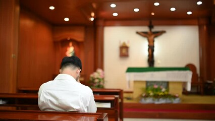 Christian man asking for blessings from God,Asian man praying to Jesus Christ