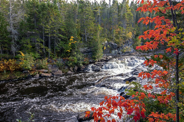 Waterfalls rush down the gorge at Gulf Hagas in the northern Maine Woods in early fall 
