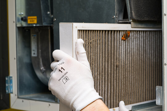 hvac filter replacing. Replacing the filter in the central ventilation system, furnace. Replacing Dirty Air filter for home central air conditioning system. Change filter in rotary heat exchanger
