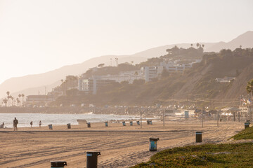 Malibu Beach View with Ocean, Village, Sand, and Mountain Zoomed by Telephoto Lens on Sunset Time 
