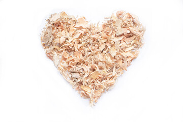 wood shavings or sawdust forming a heart on a white background ecological concept