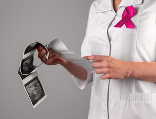 Breast cancer awareness concept. Doctor studying scan, ultrasound result. High quality photo