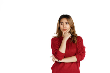 Fototapeta premium Excited confident asian happy woman in winter sweater red color isolated on white background. Thinking
