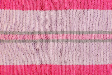 Obraz premium pink striped knit fabric fabric hand knitted