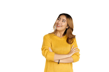 Attractive positive young asian brunette woman in yellow sweater on white background.