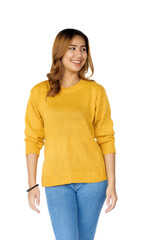 Obraz premium Attractive positive young asian brunette woman in yellow sweater on white background.
