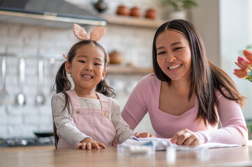 Child and her mom enjoying their handicraft activity