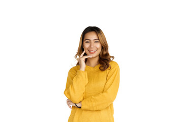 Fototapeta premium Attractive positive young asian brunette woman in yellow sweater on white background.