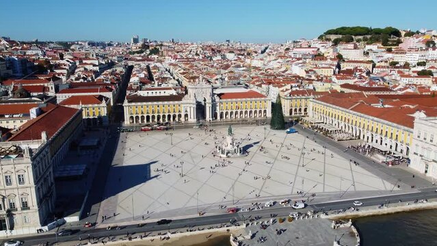 Lisbon, Portugal; Aerial drone footage of the famous commerce square, the pracia do comercio, in Lisbon historic city center by the Tage river in Portugal capital city. Shot with a forward motion. 