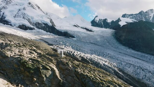 The Monte Rosa hut in Switzerland alps. Drone flight to the left
