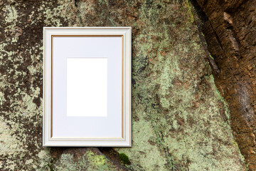 Empty frame mockup with copy space, text or art space on mossy rock texture background