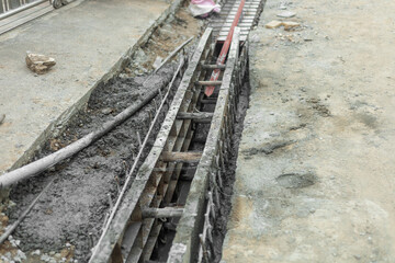 The ditch building at the concrete road side to control the water in rainy season. 