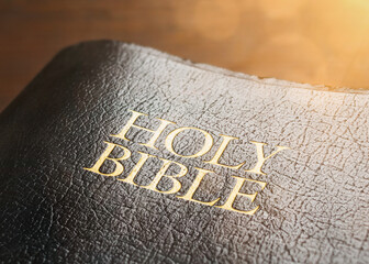 Closeup of the Holy Bible with sun flare