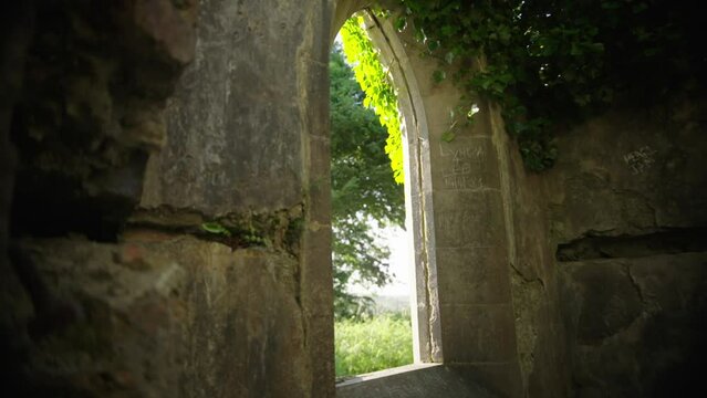 Slow motion of Old Irish church ruins from inside in Westmeath, Ireland