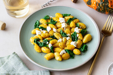 Pumpkin gnocchi with spinach and white cheese. Healthy eating. Vegetarian food.