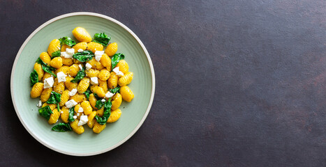 Pumpkin gnocchi with spinach and white cheese. Healthy eating. Vegetarian food.