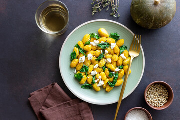 Pumpkin gnocchi with spinach and white cheese. Healthy eating. Vegetarian food.