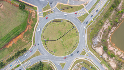 Aerial top down view of traffic roundabout on a main road. Aerial view of roundabout in the city in...