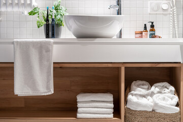 Wooden countertop with shelf for storage fresh and white terry towels