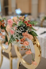 Moden wedding decoration indoors with multi floral ambience. Orange accent flowers. White and Orange theme wedding ceremony. Intimacy family dinners. 