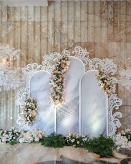 Moden wedding decoration indoors with multi floral ambience. Orange accent flowers. White and Orange theme wedding ceremony. Intimacy family dinners. 