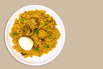 Home made south indian authentic donne biryani with boiled egg and served with white plate for one