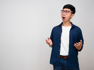 Asian man wear glasses gesture amazed isolated