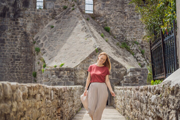 Fototapeta premium Woman tourist in Herceg Novi old town. Historical and touristic center of Herceg Novi. Montenegro