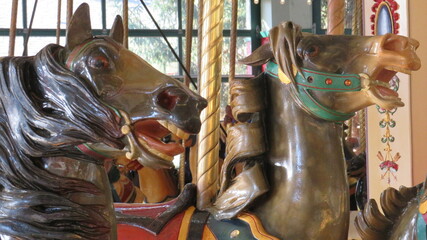 Fototapeta na wymiar carousel horses on the carousel