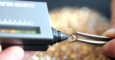 Jeweler evaluating quality of gemstone using diamond selector closeup 4k movie slow motion