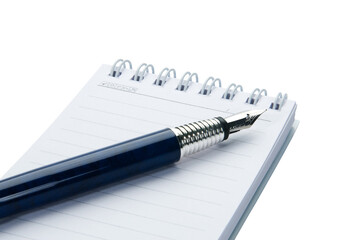 Pen on notebook, isolated on white background.