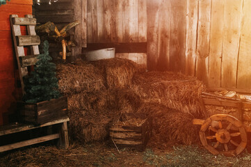 sheaves of hay in a wooden barn. harvesting food dry straw for feeding livestock. rustic country...