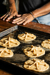 elaboration of bread of the dead, november 2, mexican tradition, mexican bread with sesame seeds