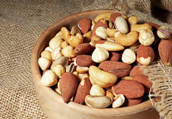 Fototapeta na wymiar mixed nuts in a wooden bowl