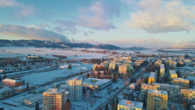Aerial view of wonderful winter scenery roof houses snowy covered. Beautiful landscapes. Blue sky. Morning
