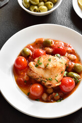 Cod stew with chickpeas, cherry tomatoes and olives