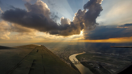 Fototapeta na wymiar Sunset viewed from inside a B-17 bomber while looking over the Missouri river in Kansas City